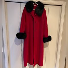 Superfine Virgin Wool And Cashmere Long Red Coat Duster Coat With Removable Fur Collar And Cuffs! This Coat Is Absolutely Stunning In Person And In Perfect Condition. Literally Looks Like It Has Never Been Worn! I Bought This From A Vintage Designer Sale And, Unfortunately, It’s Just A Little Too Big For Me. There Are No Size Or Brand Tags (Only Tag Is Shown In Pictures) But I Would Say It’s A Size Large. I Don’t Think The Fur Is Real But I May Be Wrong. Both The Fur Collar And Cuffs Are Removab Classic Red Outerwear For Evening, Elegant Red Evening Outerwear, Classic Red Evening Outerwear, Elegant Red Outerwear With Button Cuffs, Red Fur Coat With Faux Fur Trim For Winter, Red Long Coat, Red Long Coat With Button Closure, Red Winter Fur Coat With Faux Fur Trim, Vintage Red Outerwear With Stand Collar