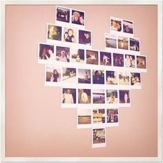 a collage of photos arranged in the shape of a heart on a pink wall