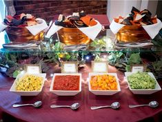 a table topped with bowls filled with different types of food