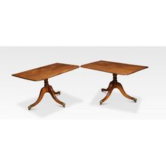 a pair of wooden tables with wheels on each side