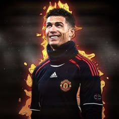 the manchester united player is smiling and wearing his red and black uniform with flames behind him