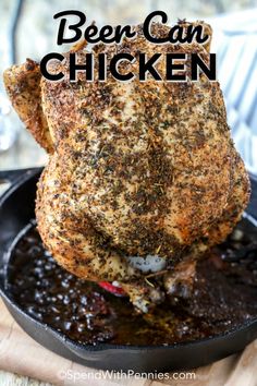 a cooked chicken in a cast iron skillet with the words beer can chicken on it