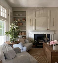 a living room filled with furniture and a fire place