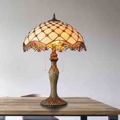 a table lamp sitting on top of a wooden table