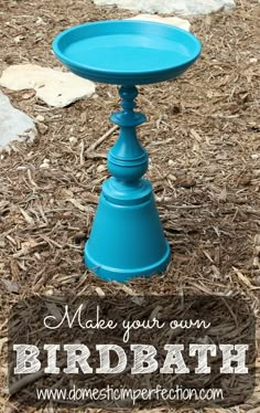 a blue table sitting in the middle of some mulch on top of a field