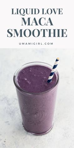 a purple smoothie in a glass with a blue and white striped straw