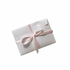 an open white gift box with a pink ribbon