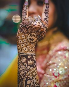 a woman holding her hand up to the camera