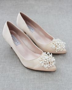 "Perfect pointy toe heels with elegant mini pearls brooch is beautiful simplicity. Easy slip on with comfort for bride and wedding party. DETAILS: HEEL HEIGHT: 2 inches COLORS AVAILABLE: White, off white, black and champagne UPPER: Synthetic upper and lining MATERIALS: Mandmade outsole - Please see our \"Policies\" section for information regarding RETURNS and EXCHANGES. - Stay updated with latest news or promotion as we grow and follow us on the following outlets: Instagram: http://instagram.co Formal High Heel Pearl Wedding Shoes, Formal Pearl High Heel Wedding Shoes, Formal Pearl Wedding Shoes High Heel, Formal Closed Toe Pearl Heels, Elegant Pearl Wedding Shoes, Pearl Wedding Shoes With Round Toe For Formal Occasions, Pearl Wedding Shoes With Pointed Toe, Pearl Wedding Shoes With Round Toe, Elegant Closed Toe Pearl Heels