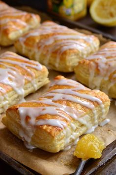 lemon scones with icing on a wooden cutting board