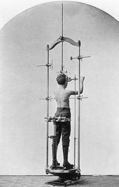 a man standing on top of a machine