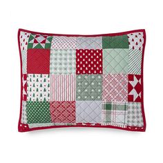 a red and green patchwork pillow on a white background