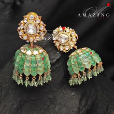 Silver Moissanite Polki Emerald Jhumka, Polki Kundan Earring, Indian Wedding Jewelery, Moissanite Polki Jhumki, Big Jhumka, Bridal Earring Material : Silver Gemstone: Moissanite , Swarovski Stones Stone colour: Uncut Polki Primary colour: Gold Size-Length: 55mm Width: 35mm Closure : Screw back and Clips Silver Intricate, hand crafted, Pure Silver Polki Jhumka, studded with high quality Moissanite Polki Earring comes with screw back and clips, made in 92.5 silver with 22ct gold plating. Product c Silver Fusion Jhumkas For Reception, Hand Set Jhumkas For Diwali Reception, Festive Fusion Kundan Jhumkas, Green Hand Set Fusion Jhumkas, Fusion Style Stone Work Jhumkas For Receptions, Hand-set Jhumkas For Reception And Festivals, Hand Set Jhumkas For Reception And Festivals, Fusion Style Jhumkas For Reception With Stone Work, Fusion Style Wedding Jhumkas For Festivals