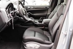 the interior of a vehicle with black leather seats