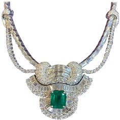 Emerald & Diamond Necklace Gold Type: Platinum Emerald Weight: Approx 5.48 Cts Diamond Weight Approx: 26.00 Cts Measurements: 14.5" in diameter Luxury Diamond Emerald Necklace Hallmarked, Luxury Dazzling Emerald Necklace With Diamonds, Luxury Dazzling Emerald Diamond Necklace, Luxury Hallmarked Diamond Emerald Necklace, Luxury Brilliant Cut Emerald Necklace For Wedding, Luxury Dazzling Emerald Necklace, Elegant Luxury Pear-shaped Emerald Necklace, Luxury Jeweled Emerald Necklace For Wedding, Luxury Dazzling Green Emerald Necklace