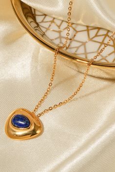 Material: Stainless steel, 18K gold-plated, Lapis lazuli Care instructions: Avoid wearing during exercise, as sweat will react with the jewelry to produce silver chloride and copper sulfide, which causes the jewelry to deteriorate and corrode over time. Imported Product measurements: Chain length: 16.5 inExtension chain length: 2 inPendant length: 0.7 in (1.8 cm)Weight: 0.14 oz (4 g) Necklace Measurements, Lapis Lazuli Pendant, Lapis Lazuli Necklace, Brooch Necklace, Blue Gemstones, Girls Jewelry, Gold Pendant Necklace, Lapis Lazuli, Chain Length