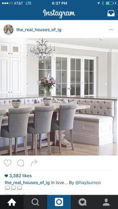 the dining room table is surrounded by gray chairs and white cabinets, with pink - peppermint designs