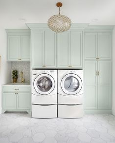 an instagram photo of a laundry room with two washers and dryer in it