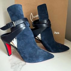 Gorgeous Excellent Condition Navy Suede Bootie With Walkable 85mm Heel And Leather Ankle Straps. Kept In Original Box With Dust Bag. Worn Twice, So They Deserve A New Owner. Includes Extra Heel Taps In Red Clb Bag. Elegant Open Heel Formal Boots, Designer Ankle-high Heels With Sculpted Heel, Christian Louboutin Suede Boots, Ankle-high Suede Boots With Red Sole, Luxury Blue Pointed Toe Heeled Boots, Blue Ankle-high Boots With Leather Sole, Heel Taps, Blue Christian Louboutin Heels, Heel Tap