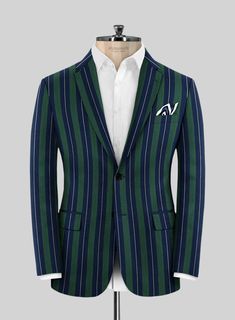 Aim for a chic wardrobe destination with the addition of our Napolean Izzaro Stripe Green Blue Wool Jacket. Besides, it is made from a blend of wool and micro rayon cloth, which grants a thin, sharp and silky smooth touch with a bit of glow to the surface with a green and blue striped pattern, creating a unique take on the formal collection. Meanwhile, the cloth is cut with precision. Also, the durability and stylish cuts with a tailored fit reveal subtle impressions. Lastly, get hold of this ve Chic Wardrobe, Plaid Suit, Button Jacket, Wool Suit, Blue Wool, Green Plaid, Jacket Buttons, Green And Blue, Wool Fabric