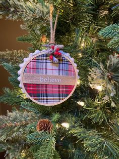 a christmas ornament hanging from the top of a tree