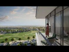 an artist's rendering of a woman standing on a balcony overlooking a golf course