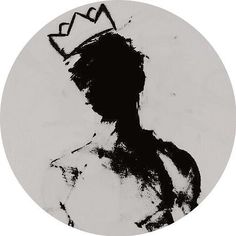 a black and white photo of a person with a crown on their head in a circle