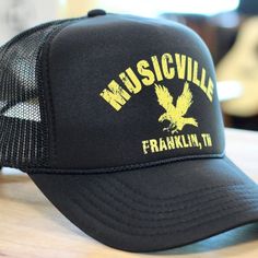 Musicville Eagle Hat

Otto Cap 5 Panel High Crown Mesh
Back Trucker Hat
Color: Black + Yellow
Fit: One Size Fits Most
May 2024 Update: same desi... Urban Black Trucker Hat For Summer, Black Urban Trucker Hat For Summer, Casual Black Hat For Music Festival, Black Hip Hop Trucker Hat With Short Brim, Vintage Black Trucker Hat For Summer, Black Baseball Cap For Music Festival, Black Hats For Summer Music Festival, Black Summer Hats For Music Festival, Black Summer Music Festival Hats