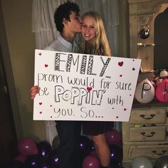 a man and woman holding a sign that says,'i am my prom would for sure to be poppy with you so '