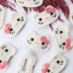 crocheted cat broochies with hair clips and pins in the shape of cats