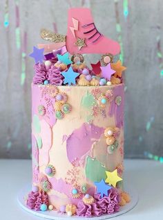 a pink and purple cake with stars on it