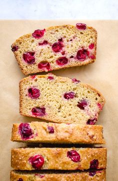 four slices of bread with cranberries on top