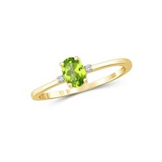 a yellow gold ring with an oval green stone and two white diamonds on the side