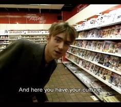 a man is standing in front of a store aisle