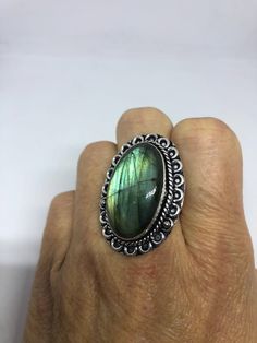 Huge blue green Labradorite rainbow moonstone Lovely vintage silver setting is low content silver Size 9.5 My jeweler can re size it up or down for a $15 fee Ring is long covers from knuckle to knuckle. All rings are shipped in a nice gift box. Check out our over a THOUSAND great reviews Engraving is $4 per letter and is not always perfect depending on the piece. It can take a few days if the jeweler is busy. This is payable to Paypal Judithsltd@gmail.com Vintage Oval Labradorite Jewelry, Vintage Silver Moonstone Ring With Large Stone, Vintage Labradorite Gemstone Rings, Vintage Labradorite Gemstone Jewelry, Vintage Labradorite Ring, Green Labradorite Ring, Green Labradorite, Labradorite Stone, Rock Style