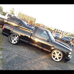 a black pickup truck parked in a parking lot