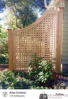 a wooden fence in front of a house