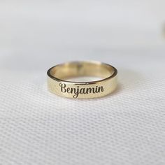 About item Item :- Custom Band engraved ring Ring size :- Chose from variation (Custom size accepted) Material  :- 925 Sterling silver Purity  :- 92.5 Title:- Personalized Word Ring, Custom Name Ring, Dainty Name Ring, Personalized Stacking Ring Gift, Unisex Ring, Unique Anniversary Gift for Her, Valentine's day gift, Promise ring, Couple rings, Girlfriend ring, Delicate ring Description:- We use 925 sterling silver to making jewelry. We accept all types of custom & personalized order. Please send us a message if you are interested in a custom creation. Shipping profile:- We ship all order within 3-5 days. But custom order takes time. Customer service :- If you have any question about our products & services, feel free to contact us. We do always best for our customers Other Specification: Initial Ring Gold Personalized, Adjustable Ring With Engraved Text For Promise, Yellow Gold Hand Stamped Promise Ring, Adjustable Promise Ring With Engraved Text, Adjustable Engraved Initial Ring, Adjustable Engraved Ring With Text For Promise, Adjustable Engraved Gold Rings, Gold Engraved Midi Rings As A Gift, Hand Stamped Yellow Gold Engraved Ring For Anniversary