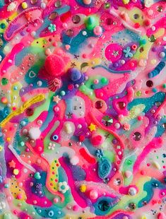 an abstract painting with lots of different colors and shapes on it's surface, as well as bubbles