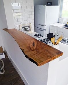 the counter top is made out of wood and has been cut into pieces to make it look