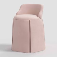 an upholstered pink chair with a curved back and seat, viewed from the front