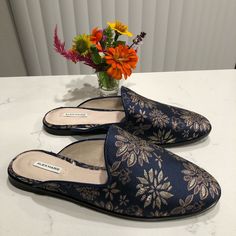 Brand New Never Used Alex Marie Cadina Floral Slip On Mules Brocade Fabric Upper Leather Lined Cork Insert Sole Size 8 Color Blue And Tan Embroidered Floral Print Blue Formal Slip-ons For Spring, Formal Blue Slip-ons For Spring, Blue Flat Loafers For Fall, Formal Flat Slippers With Removable Insole, Blue Formal Flats For Spring, Blue Closed Toe Flats For Fall, Formal Closed Toe Slippers, Formal Closed-toe Slippers For Spring, Blue Closed Toe Flats For Formal Occasions