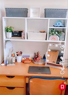 a wooden desk topped with lots of drawers next to a white shelf filled with items