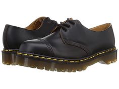 Dr. Martens Made In England 1461 Bex Toe Cap - Shoes : Black : Stay on trend in the classic styling of the Dr. Martens Made In England 1461 Bex Toe Cap. Pair with your favorite shirt and denim for the perfect laid-back look. Traditional lace-up closure offers a secure fit. Classic round toe silhouette. Grooved sides with yellow welt stitching. Leather upper. Leather and textile lining and insole. Synthetic outsole. Imported. Measurements: Heel Height: 1 1 2 in Weight: 1 lb 10 oz Platform Height: Leather Footbed Lace-up Oxfords For Streetwear, Classic Lace-up Oxfords For Streetwear, Casual Fitted Oxfords For Work, Casual Leather Oxfords For Streetwear, Casual Black Cap Toe Oxfords, Stitching Leather, Dr. Martens Boots, Platform Shoes, Shoes Black