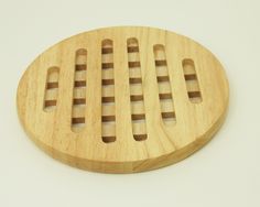 a wooden cutting board with holes in it