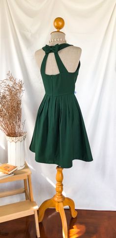 Green Backless Bridesmaid Dress, Dark Green Mini Dress For Summer, Green Mini Dress For Garden Party, Summer Bridesmaid Dress With Back Zipper, Green Mini Dress For Picnic, Backless Dress With Bow Tie Back For Garden Party, Backless Bow Tie Back Dress For Garden Party, Green Backless Dress With Tie Back For Party, Green A-line Dress For Garden Party