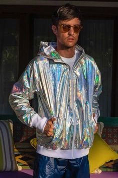 Technical and Totally Fucking Awesome: Stay warm and dry this winter in our gold or silver holographic windbreaker jacket. FEATURES: Wind and waterproof Fully lined Zip front Two side zipper pockets and one inner breast zipper pocket Relaxed fit Thumbhole cuffs Ethically made and 100% carbon neutral FIT NOTES:Unisex sizing. Runs slightly large. Designed to be a relaxed fit, if you are looking for more of a slim fit size down. Ladies or people with feminine bodies go down 2 sizes from what you no Holographic Raincoat, Moon Veil, Elf Reading, Pjs Party, Holographic Jacket, Futuristic Outfits, Festival Outfits Men, Festival Mode, Look Festival