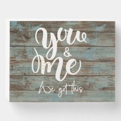 a wooden sign that says you're and me, we got this on it