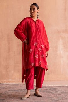 Lal chanderi textured kurta with polka dots, floral hand block print and bead embroidered sleeve hem.
Components: 1
Pattern: Hand Block Printed, Embroidery
Type Of Work: Polka dots, floral, bead
Neckline: Band collar
Sleeve Type: Full sleeves
Fabric: 40gm Chanderi
Color: Red
Other Details: 
Front button detailing
Note: Pant worn by the model is not for sale
Occasion: Work - Aza Fashions Block Printed Kurta, Red Kurti, Red Kurta, Kurta For Women, Embroidered Kurti, Red Tunic, Fashion Tops Blouse, Beaded Neckline, Indian Fashion Designers