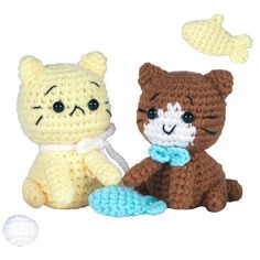 two crocheted stuffed animals sitting next to each other